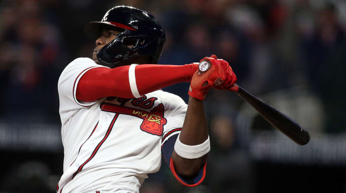 Atlanta Braves designated hitter Jorge Soler (12) hits a solo home run against the Houston Astros during the seventh inning of game four of the 2021 World Series at Truist Park.